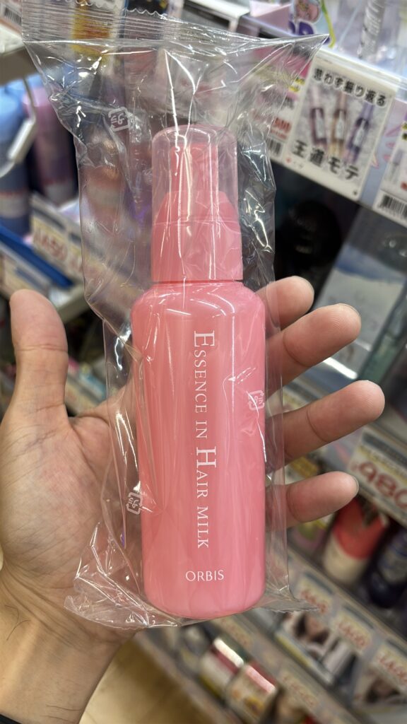 オルビス エッセンスインヘアミルクのピンク色のボトル